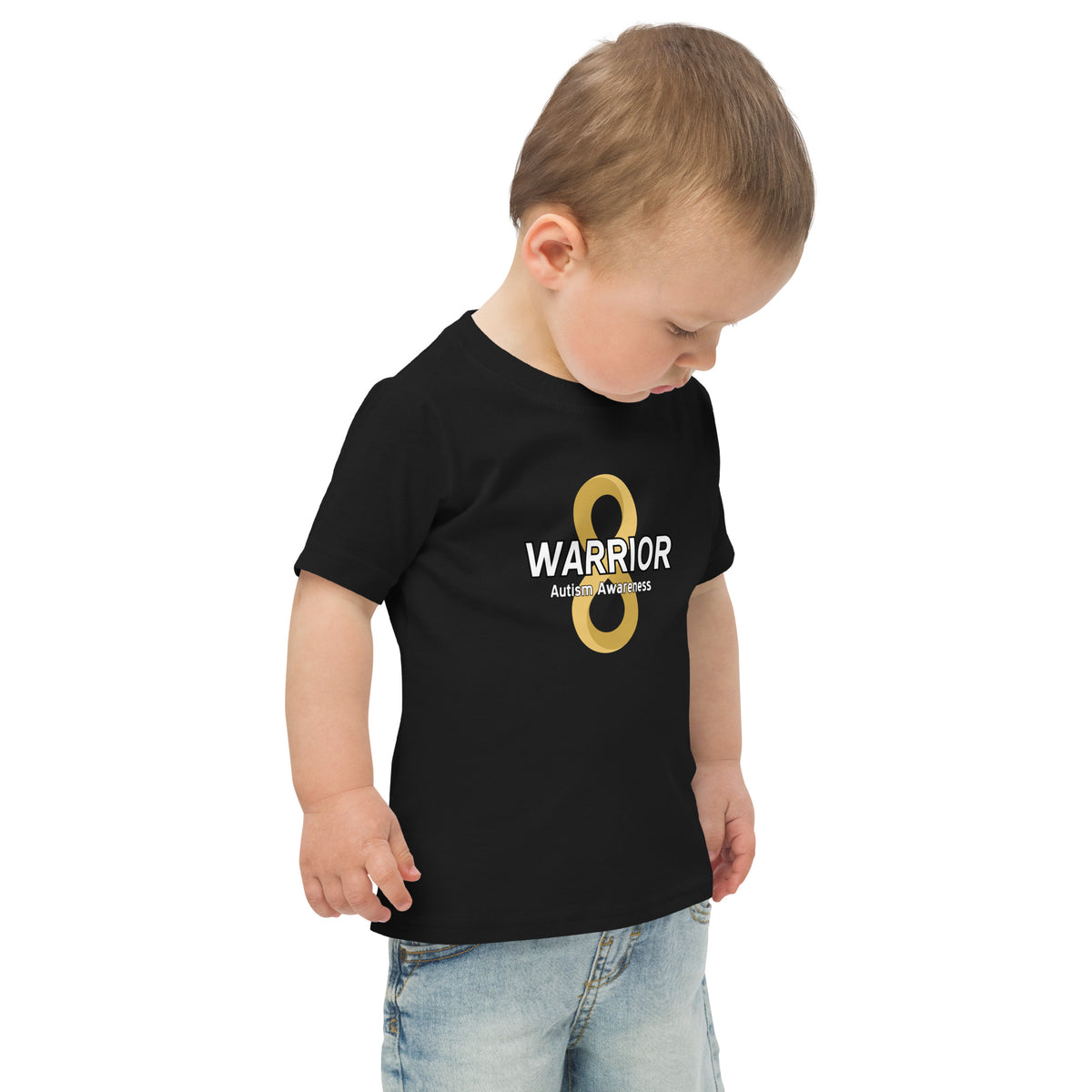 Young child wearing a black t-shirt with a large graphic autism neurodiversity gold infinity symbol logo and text 
