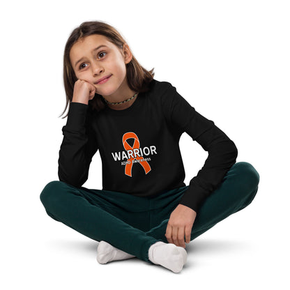 A child wearing a black long sleeve shirt with 'ADHD Warrior' text and an orange ribbon symbol on the front, sitting with their hands folded.